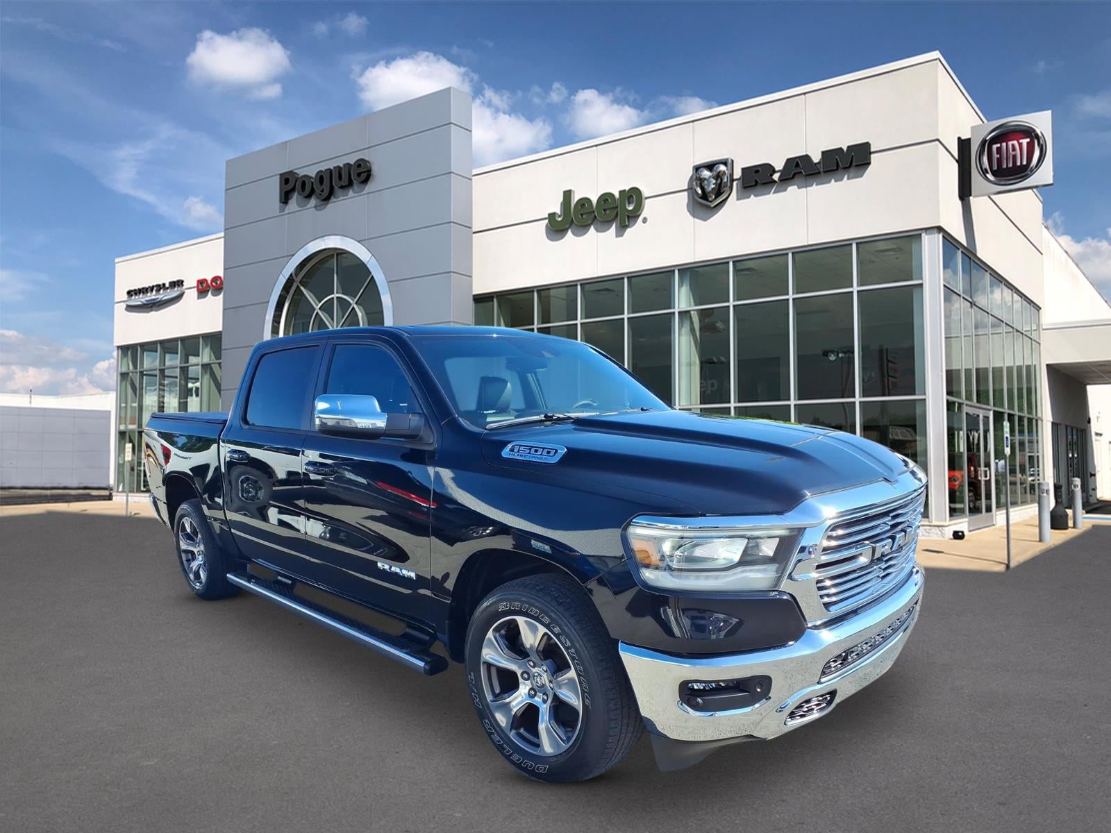 2024 RAM 1500 Laramie Crew Cab 4x4 5'7' Box in Diamond Black Crystal Pearlcoat — front three-quarter view