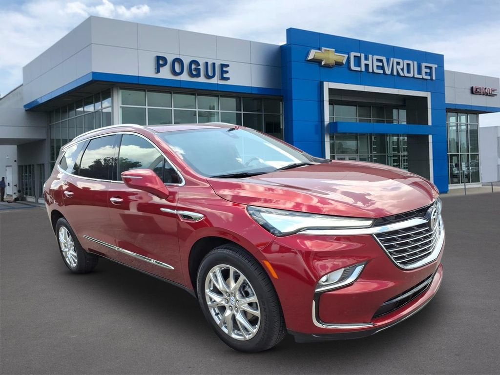 2023 Buick Enclave Essence in Cherry Red Tintcoat — front three-quarter view